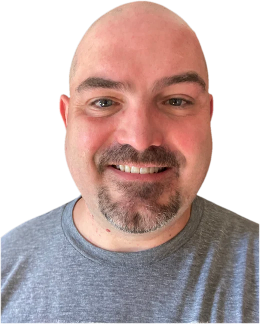 Portrait of Charles P. Borchini Jr., smiling, wearing a gray T-shirt