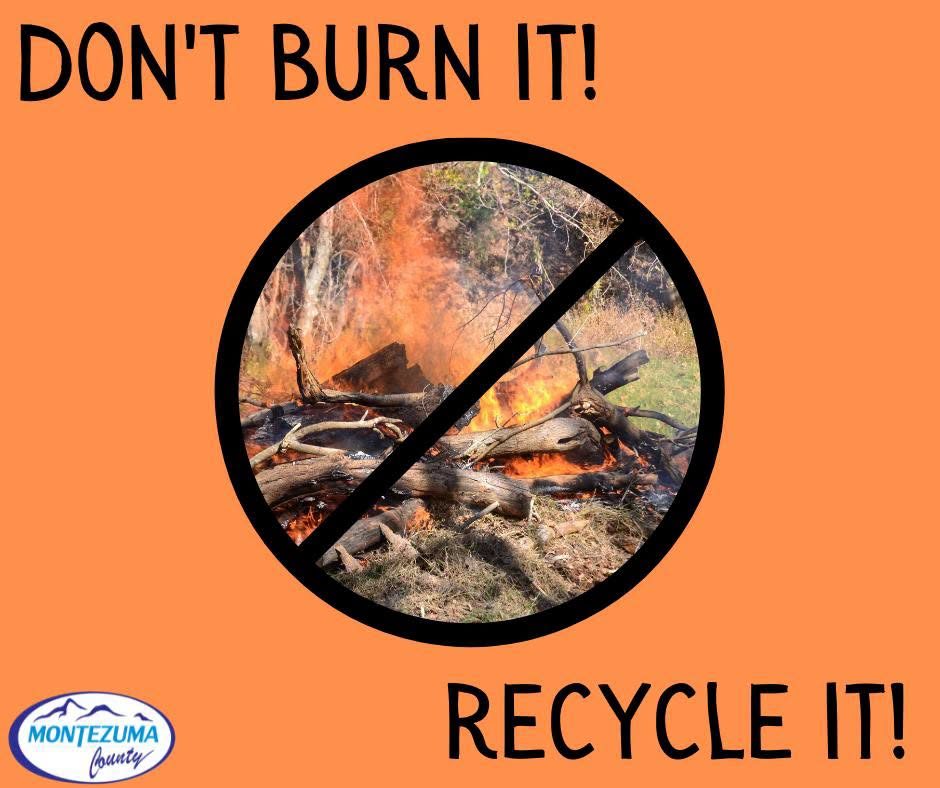 Montezuma County graphic: “Don’t burn it! Recycle it!” over a photograph of a burning brush pile crossed out by a prohibition symbol, with the Montezuma County logo.